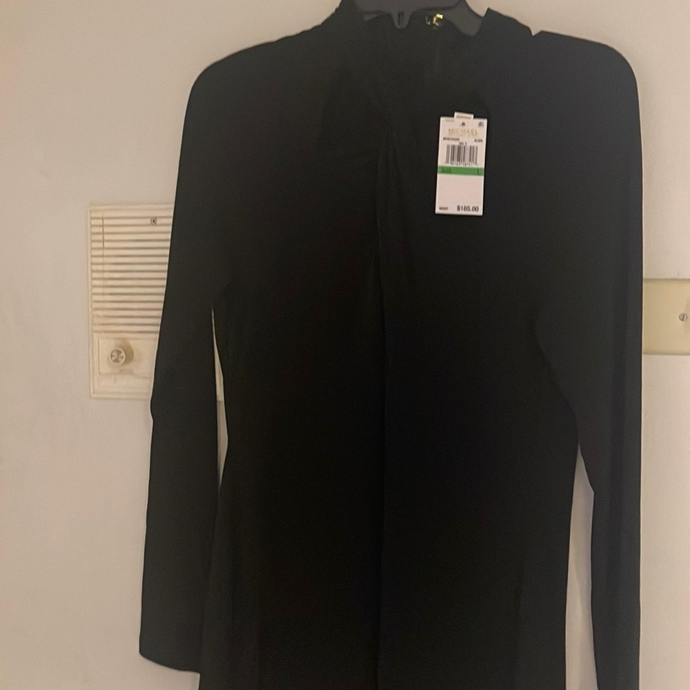 Michael Kors Black Dress. Long sleeve. Cross on the top.